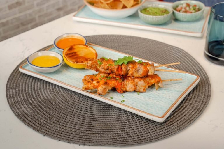 Chipotle marinated grilled chicken skewers. Served with our home made South American salsas Huancaina & Peri Peri