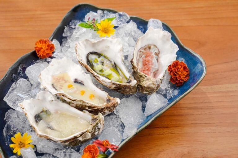 Four pieces of fresh oysters with an assortment of